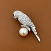 Modern Estate Diamond and South Sea Peal, Ruby 18Kt White Gold Parrot Brooch